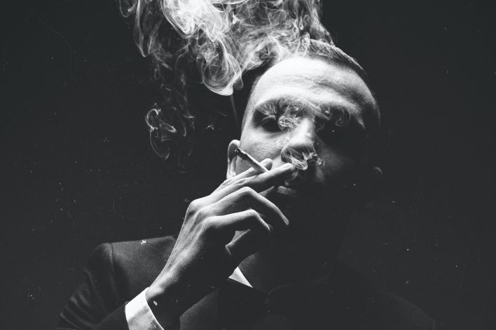 Grayscale Photo Of Man Smoking