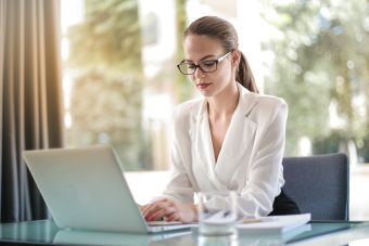 Women typing on laptop, editors, marketing professionals, RN health writer